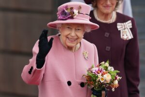 Queen Elizabeth II pictured smiling and waving